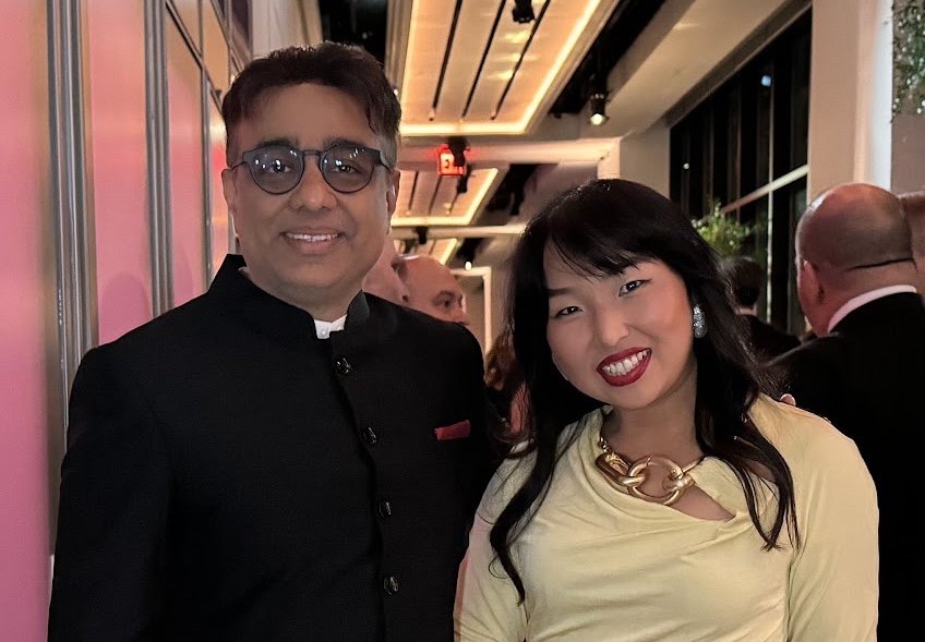 Rajiv Pant and Tiffany Xingyu Wang standing side by side indoors.